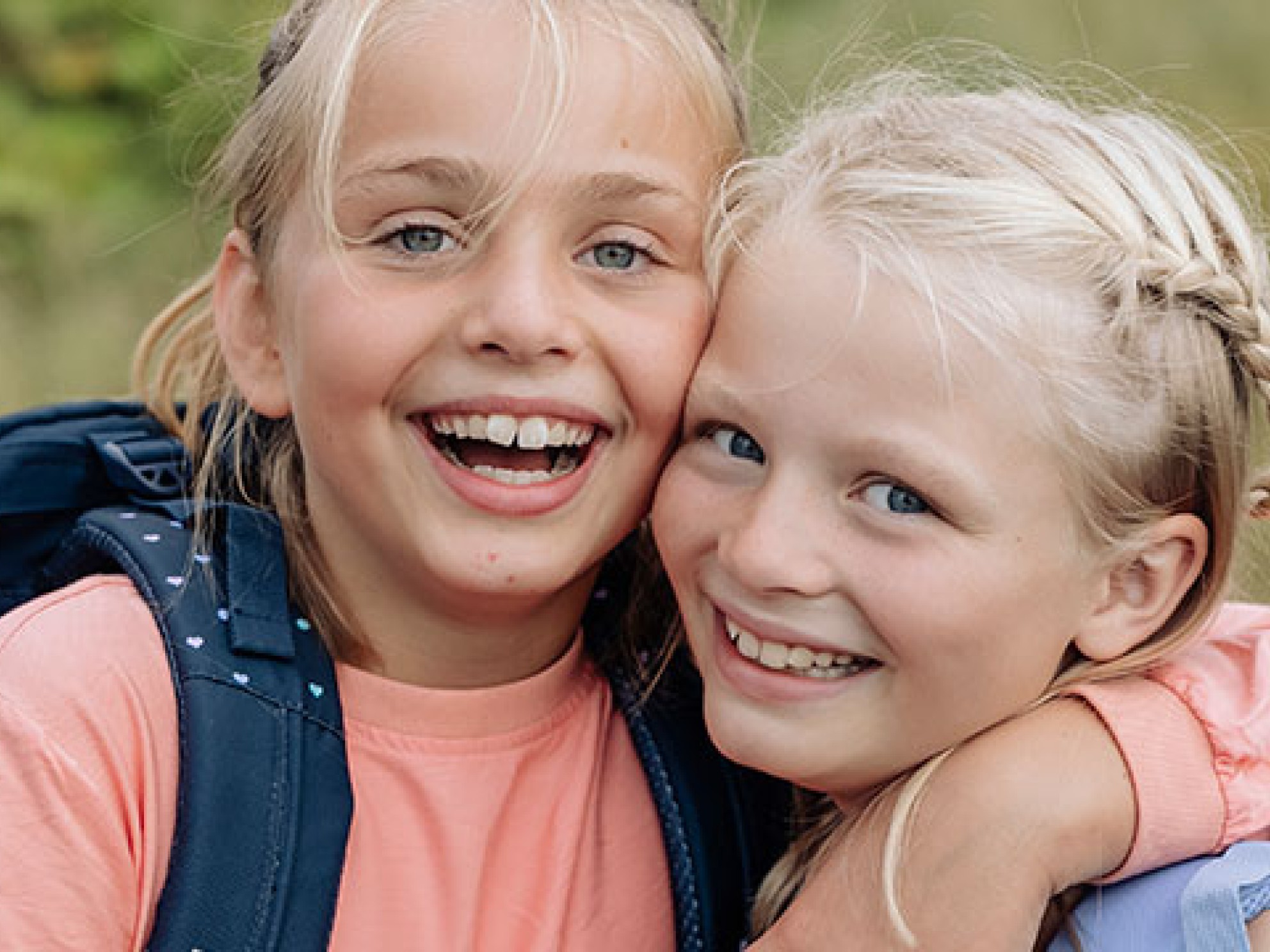 Image of two girls with backpacks