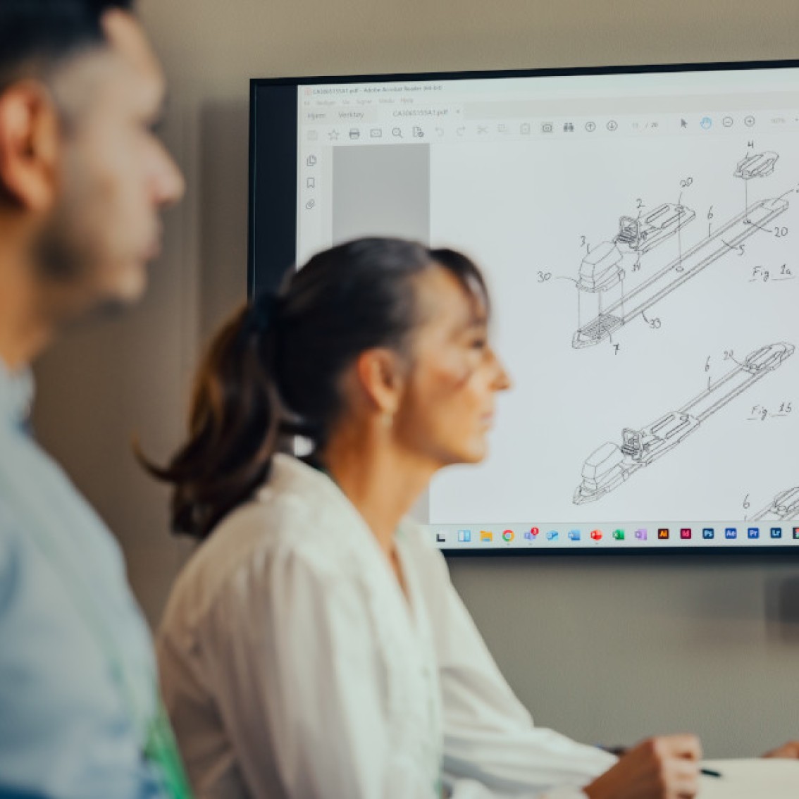 NIPO's employees are looking at a technical drawing